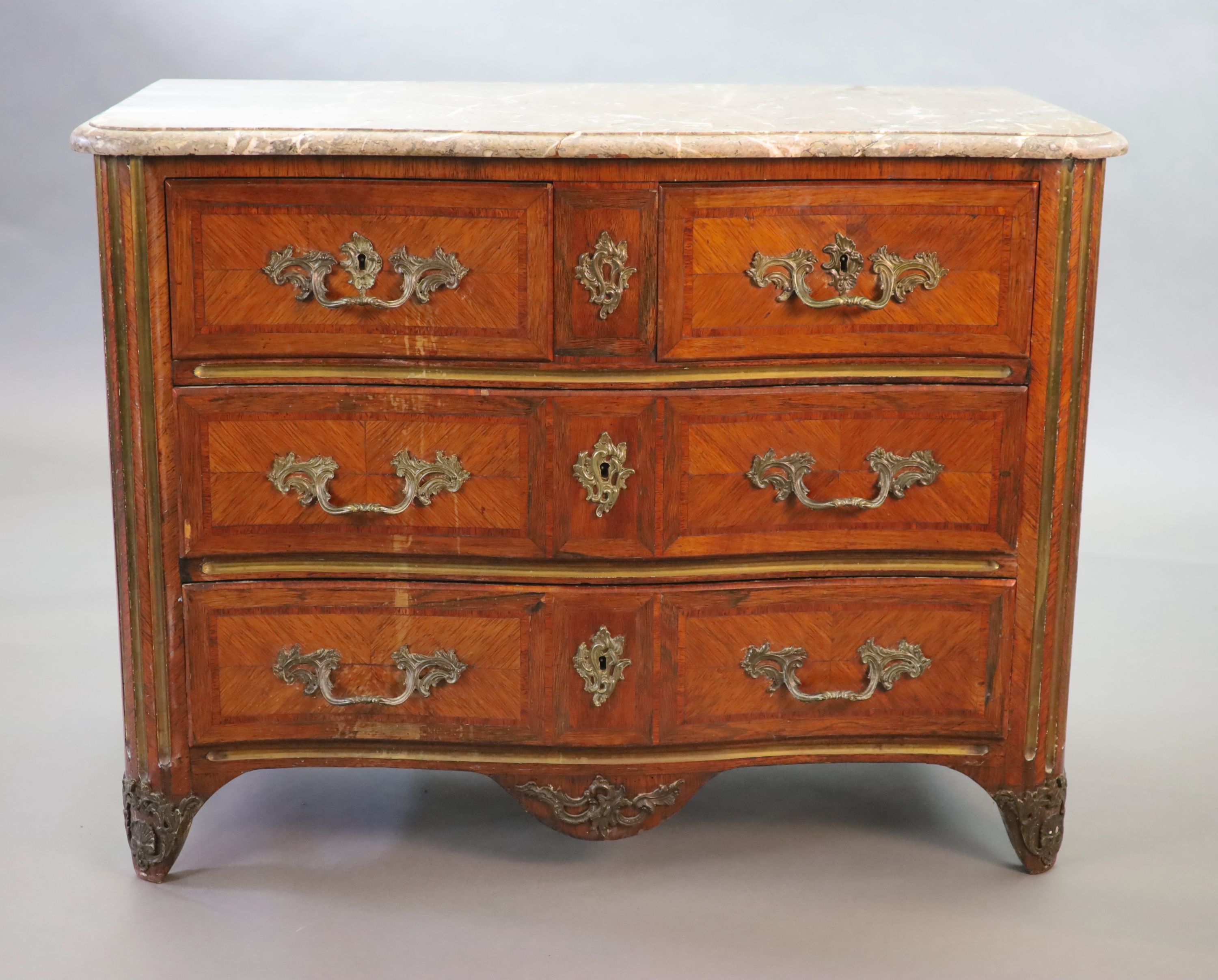 A Louis XVI parquetry serpentine commode, W.113cm D.58cm H.85cm